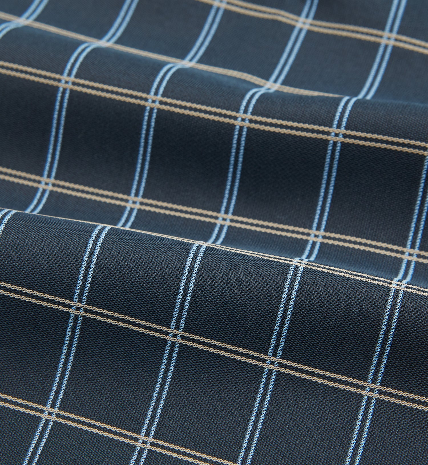 View 4 of product The Navy Fine Double Check Silk Cravat by Turnbull & Asser features a grid pattern in light blue and white lines—an elegant formal men's accessory, neatly folded with the pointed end at the bottom.