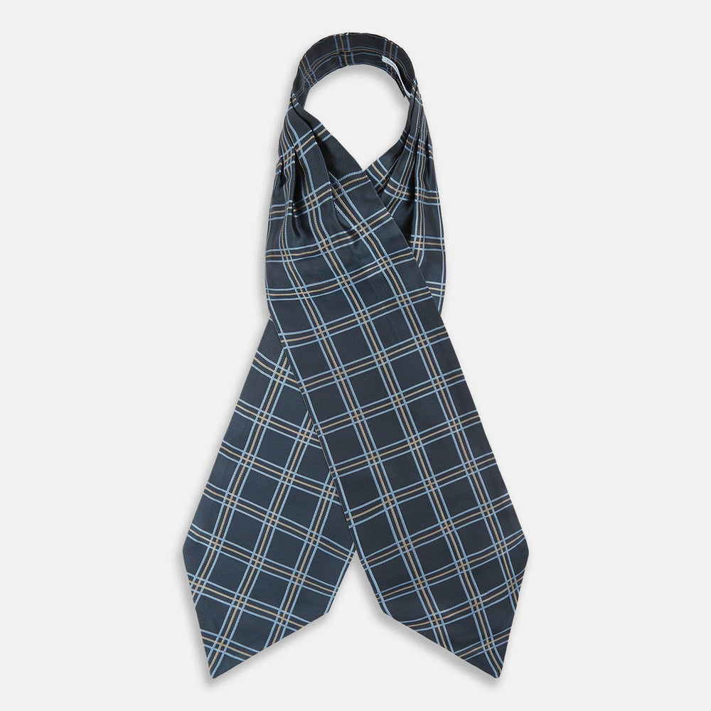 The Turnbull & Asser Navy Triple Check Silk Cravat features a classic navy, white, and light blue plaid design—perfect for adding elegance to any outfit. Shown neatly folded on a white background.
