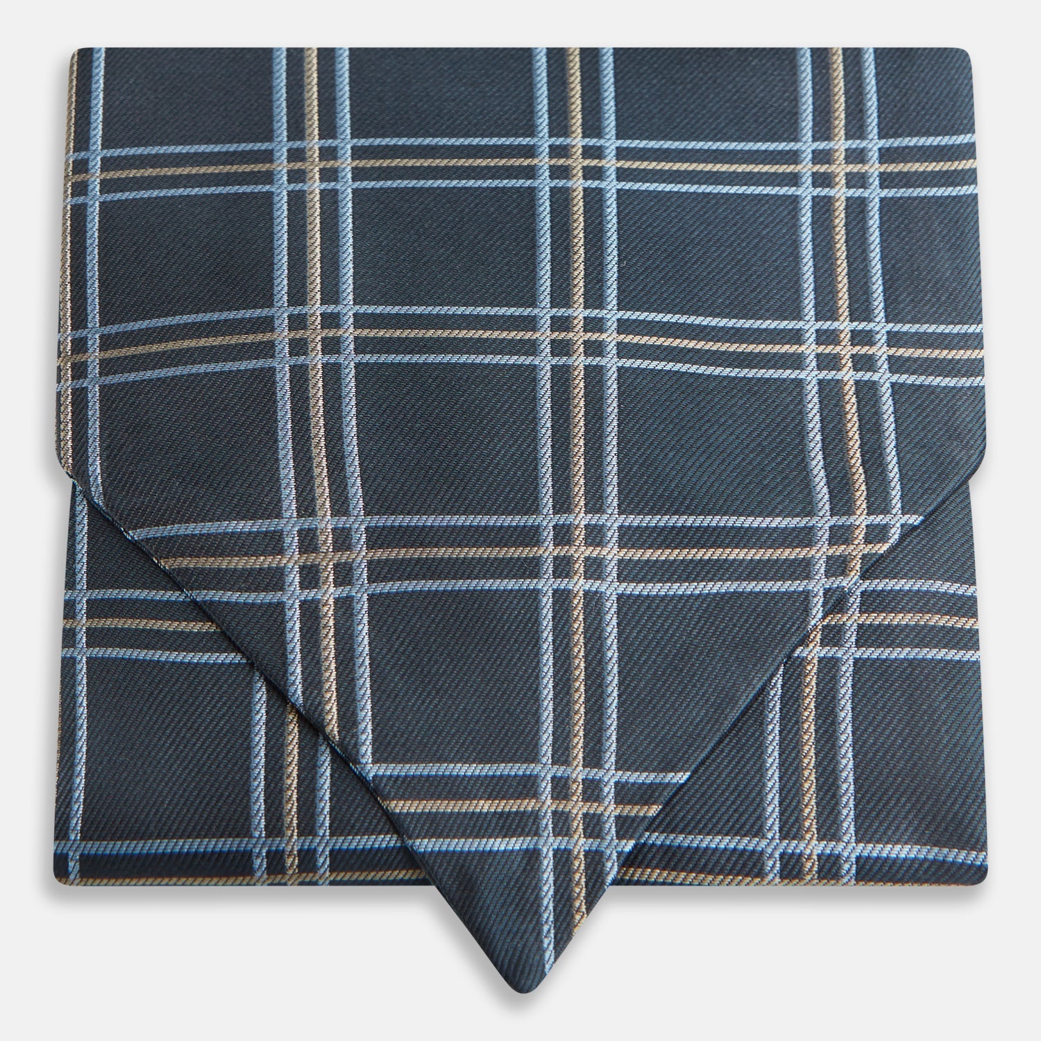 View 1 of product The Turnbull & Asser Navy Triple Check Silk Cravat features a classic navy, white, and light blue plaid design—perfect for adding elegance to any outfit. Shown neatly folded on a white background.