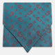 The Turnbull & Asser Teal Paisley Silk Cravat features a refined red paisley and floral pattern, adding a touch of elegance to formal men's attire.