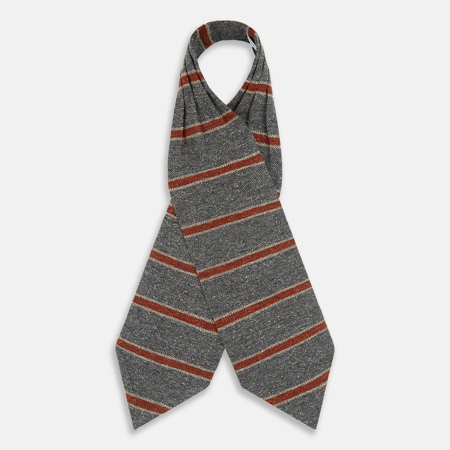 View 2 of product The Red Block Stripe Silk Cravat by Turnbull & Asser features gray textured fabric with two bold red-orange stripes and a pointed tip, reminiscent of handmade neckwear, shown against a white background.