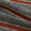 View 4 of product The Red Block Stripe Silk Cravat by Turnbull & Asser features gray textured fabric with two bold red-orange stripes and a pointed tip, reminiscent of handmade neckwear, shown against a white background.