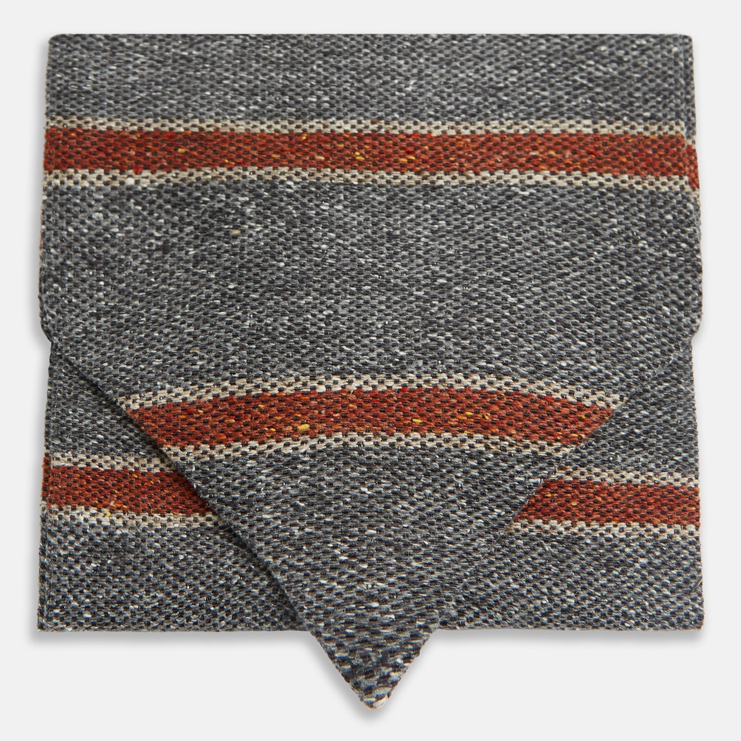View 1 of product The Red Block Stripe Silk Cravat by Turnbull & Asser features gray textured fabric with two bold red-orange stripes and a pointed tip, reminiscent of handmade neckwear, shown against a white background.