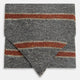 The Red Block Stripe Silk Cravat by Turnbull & Asser features gray textured fabric with two bold red-orange stripes and a pointed tip, reminiscent of handmade neckwear, shown against a white background.