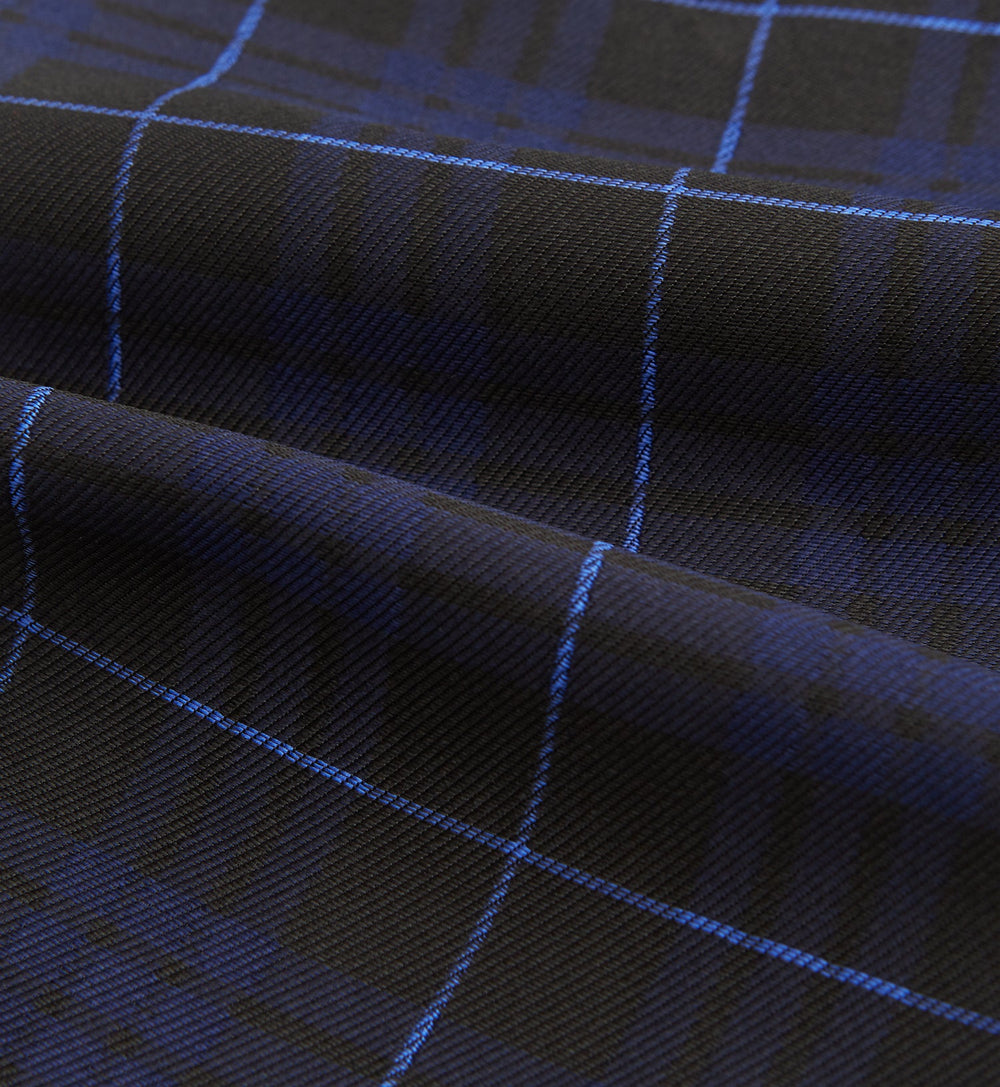 Pair the Turnbull & Asser Green Tartan Silk Cravat with a pocket square in a dark plaid of blue and black—a sharp, pointed accent that perfectly complements formal neckwear.