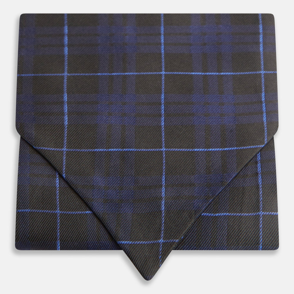 Pair the Turnbull & Asser Green Tartan Silk Cravat with a pocket square in a dark plaid of blue and black—a sharp, pointed accent that perfectly complements formal neckwear.