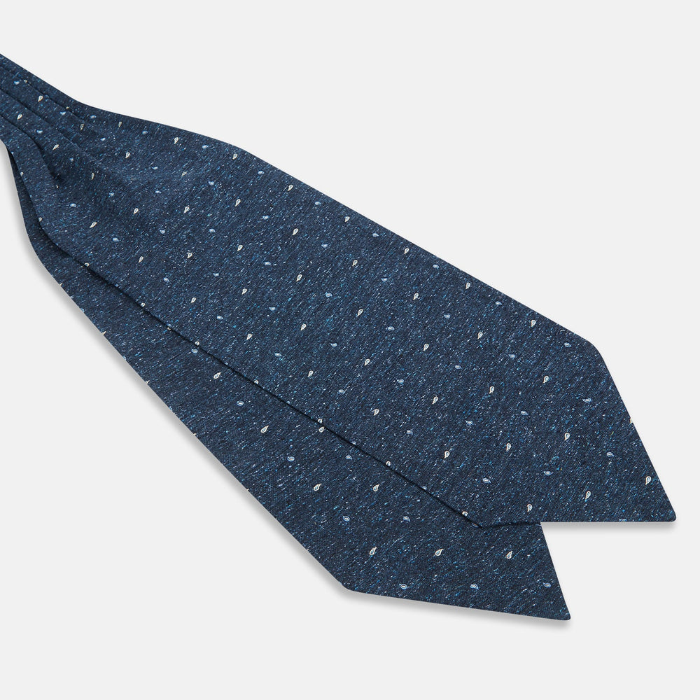 The Navy Micro Paisley Silk Cravat by Turnbull & Asser is a refined men's accessory, featuring subtle white paisley on silk—perfectly paired with a dark blue pocket square for an elegant formal look.