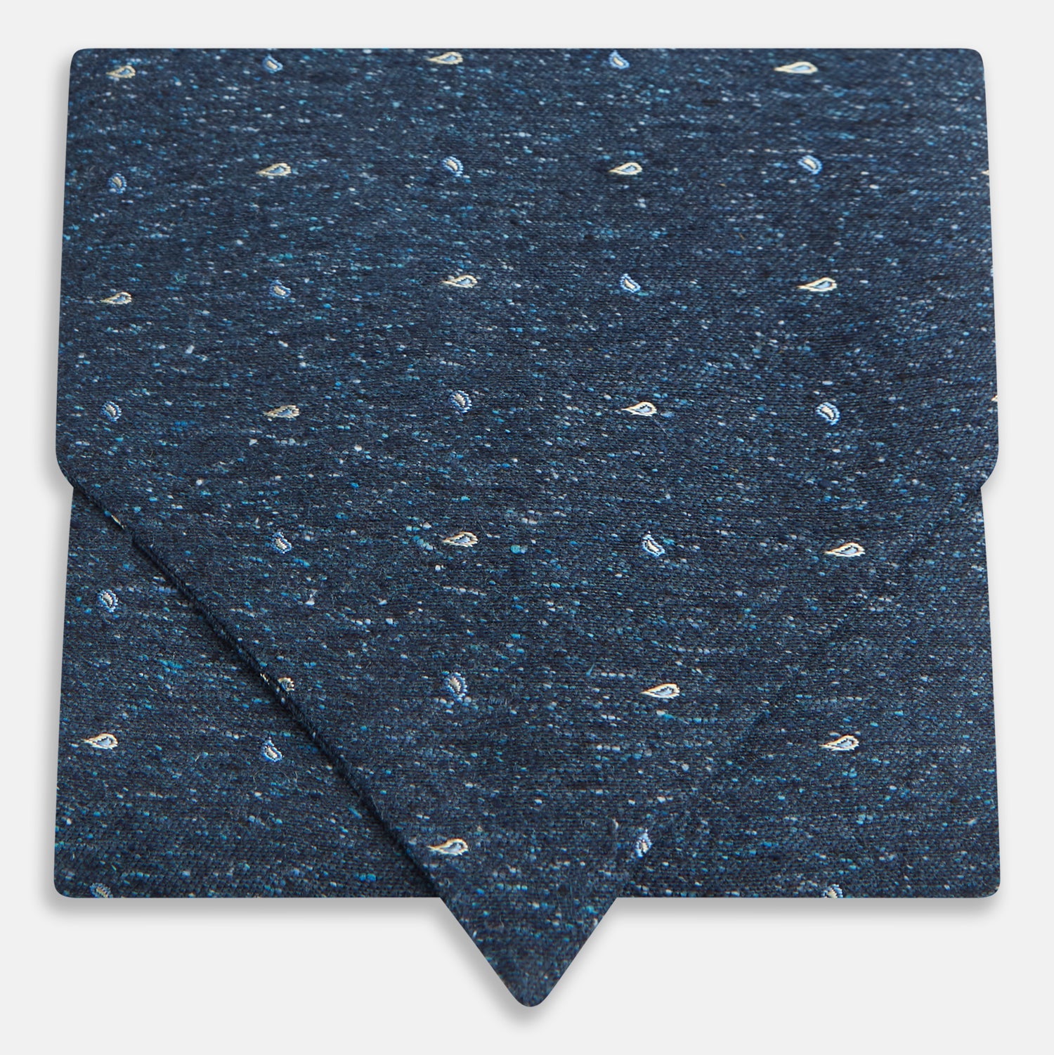 View 1 of product The Navy Micro Paisley Silk Cravat by Turnbull & Asser is a refined men's accessory, featuring subtle white paisley on silk—perfectly paired with a dark blue pocket square for an elegant formal look.