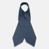 View 2 of product The Turnbull & Asser Navy Grid Silk Cravat features a textured hexagonal grid in dark and light blue on white—a refined, formal accessory perfect for any occasion.