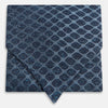 View 1 of product The Turnbull & Asser Navy Grid Silk Cravat features a textured hexagonal grid in dark and light blue on white—a refined, formal accessory perfect for any occasion.