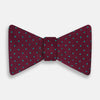 View 1 of product The Turnbull & Asser Green and Magenta Spot Silk Bow Tie, shown on a plain white background, features small, evenly spaced spots—making it an ideal accessory for elevating smart outfits.