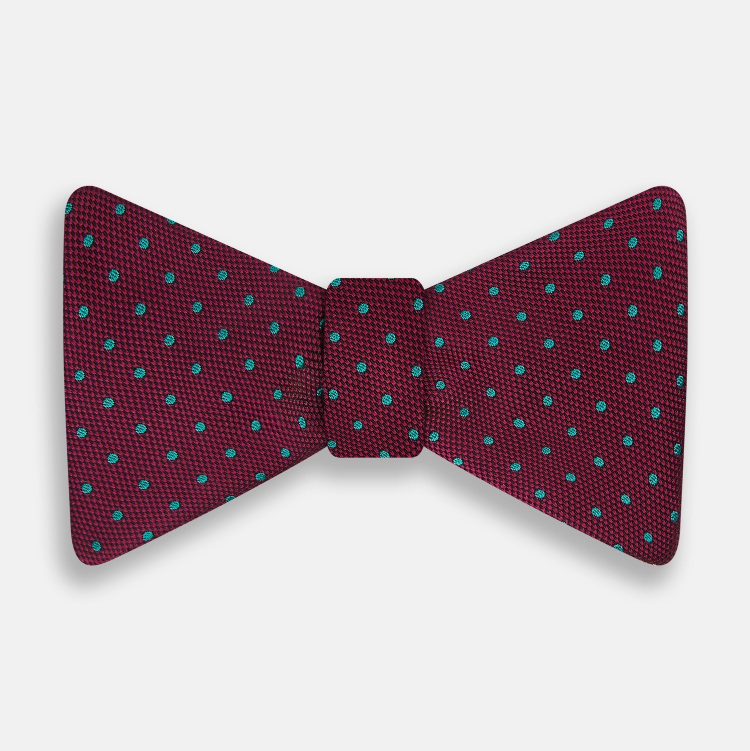 View 1 of product The Turnbull & Asser Green and Magenta Spot Silk Bow Tie, shown on a plain white background, features small, evenly spaced spots—making it an ideal accessory for elevating smart outfits.