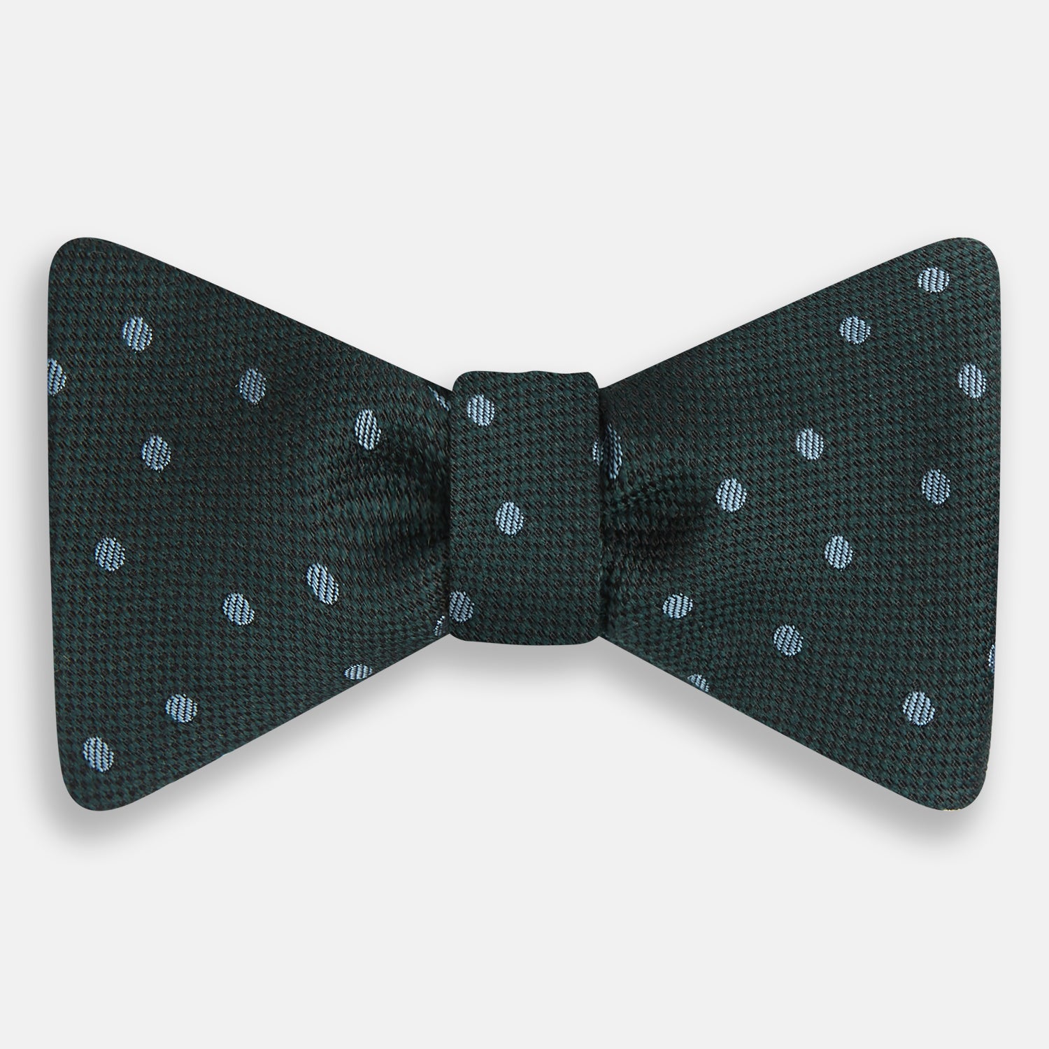 View 1 of product The Turnbull & Asser Pale Blue and Green Micro Dot Silk Bow Tie features a refined micro dot pattern, blending pale blue and green hues for a touch of British elegance, shown on a white background.