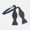 View 2 of product The Turnbull & Asser Navy Triple Check Silk Bow Tie features a navy, light blue, and beige plaid pattern on white, offering British elegance for those who value formal style.