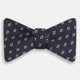 The Turnbull & Asser Blue Diamond Silk Bow Tie features small white diamond motifs on dark navy—perfect for adding classic British elegance to your formal look.