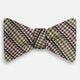 The Brown Puppytooth Stripe Silk Bow Tie by Turnbull & Asser features a houndstooth pattern in brown, beige, and burgundy with navy stripes—an elegant choice for formal occasions. Shown on a crisp white background.
