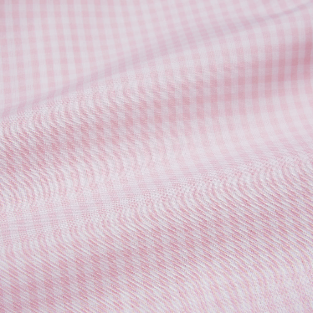 The Pink Windowpane Check Mayfair Shirt by Turnbull & Asser features a light pink, long-sleeve design with subtle windowpane checks, button-down front, and soft organic cotton, shown against a white background.