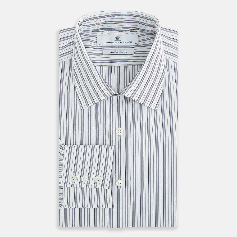 The Turnbull & Asser Navy Multi Stripe Mayfair Shirt, a pure cotton button-up with long sleeves and a collar, features thin vertical blue and white stripes and is displayed flat on a white background.