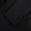 View 15 of product The Turnbull & Asser Black Single Breasted Dinner Suit, with satin lapels and matching trousers, is elegantly folded and displayed on a plain white background.