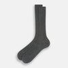 View 2 of product A single Grey Organic Cotton Mid-Length Sock by Turnbull & Asser is shown upright on a white background, featuring a ribbed texture and reinforced cuff.