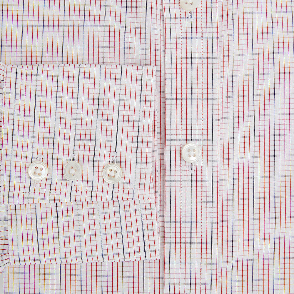 The Turnbull & Asser Red Micro Graph Check Mayfair Shirt is a long-sleeved, button-up Italian cotton shirt with a spread collar and buttoned cuffs, shown on a plain white background.