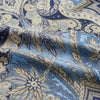 View 3 of product The Turnbull & Asser Pale Blue Baroque Silk-blend Hyde Pyjama Set features a long-sleeve button-up shirt and pants in a blue and beige paisley pattern, shown flat on a white background.