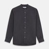 View 1 of product The Turnbull & Asser Charcoal Cotton Blend Weekend Fit Blake Shirt is a long-sleeve, stand-collar shirt with white buttons. Its minimalist design, with no pockets or patterns, makes it perfect for casual wear. Displayed flat on a white background.