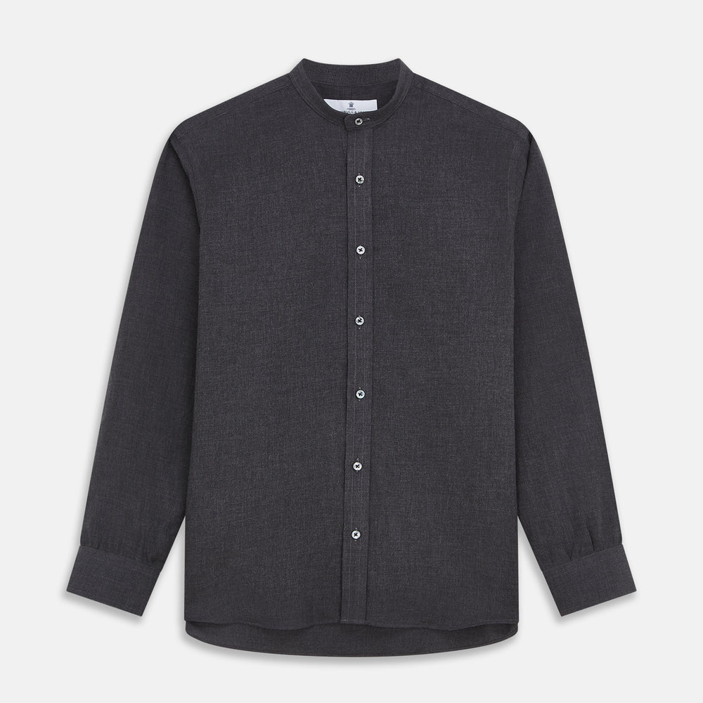 The Turnbull & Asser Charcoal Cotton Blend Weekend Fit Blake Shirt is a long-sleeve, stand-collar shirt with white buttons. Its minimalist design, with no pockets or patterns, makes it perfect for casual wear. Displayed flat on a white background.