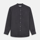 The Turnbull & Asser Charcoal Cotton Blend Weekend Fit Blake Shirt is a long-sleeve, stand-collar shirt with white buttons. Its minimalist design, with no pockets or patterns, makes it perfect for casual wear. Displayed flat on a white background.