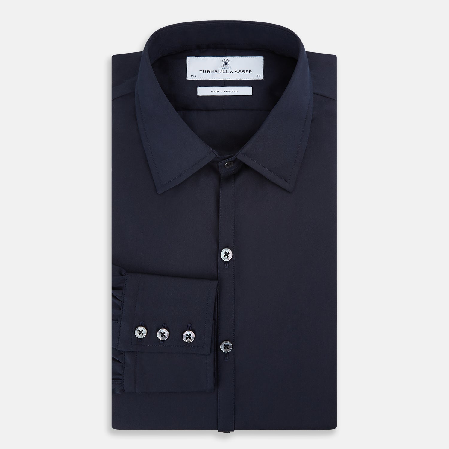 View 5 of product The Navy Westminster Shirt by Turnbull & Asser is a classic long-sleeve, button-up shirt with a pointed collar and buttoned cuffs, exemplifying British craftsmanship, shown against a plain white background.
