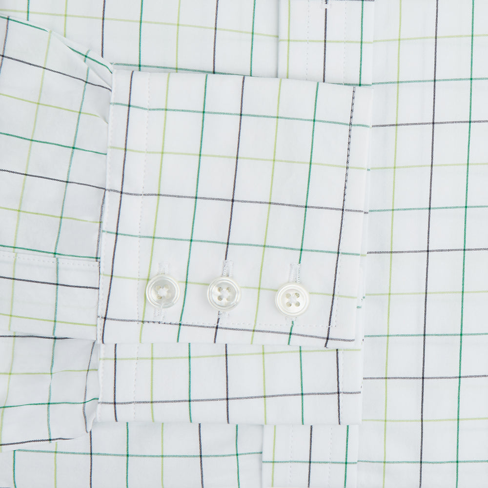 The Turnbull & Asser Dark Green Grid Check Mayfair Shirt features a white base with blue and dark green checks, a classic T&A collar, buttoned cuffs, and a Mayfair fit. The long-sleeve shirt is shown laid flat on a white background.