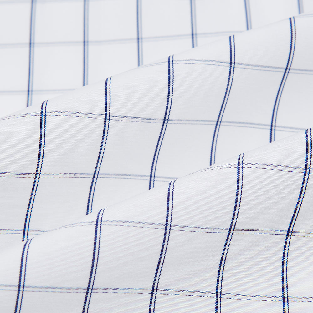 A Dark Navy Double-Line Checked Westminster Shirt by Turnbull & Asser, featuring button-down front, pointed collar, and buttoned cuffs—displaying British craftsmanship—laid flat on a white background.