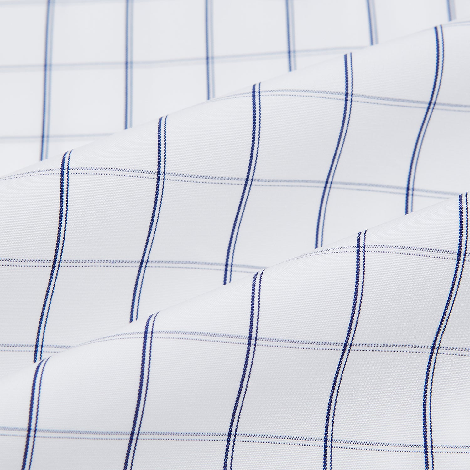 View 8 of product A Dark Navy Double-Line Checked Westminster Shirt by Turnbull & Asser, featuring button-down front, pointed collar, and buttoned cuffs—displaying British craftsmanship—laid flat on a white background.