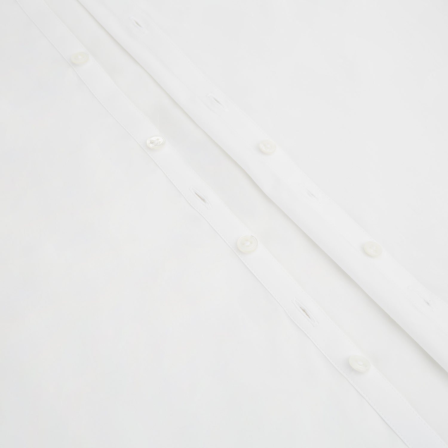 View 7 of product The Turnbull & Asser White Westminster Shirt is a long-sleeve, button-up dress shirt with a classic cut and Westminster collar, shown on a white background.