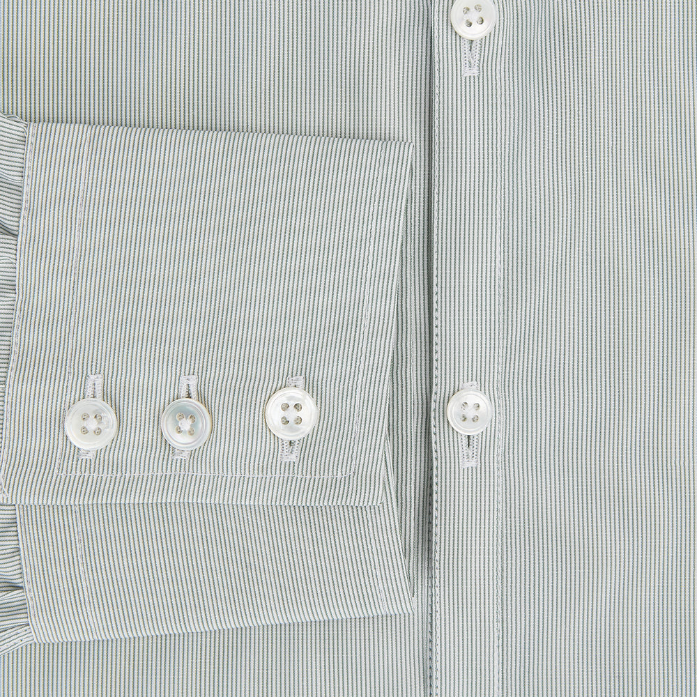 A dark green hairline stripe Westminster shirt by Turnbull & Asser, featuring long sleeves, a classic collar, tailored fit, white front buttons, and buttoned cuffs, laid flat on a white background.