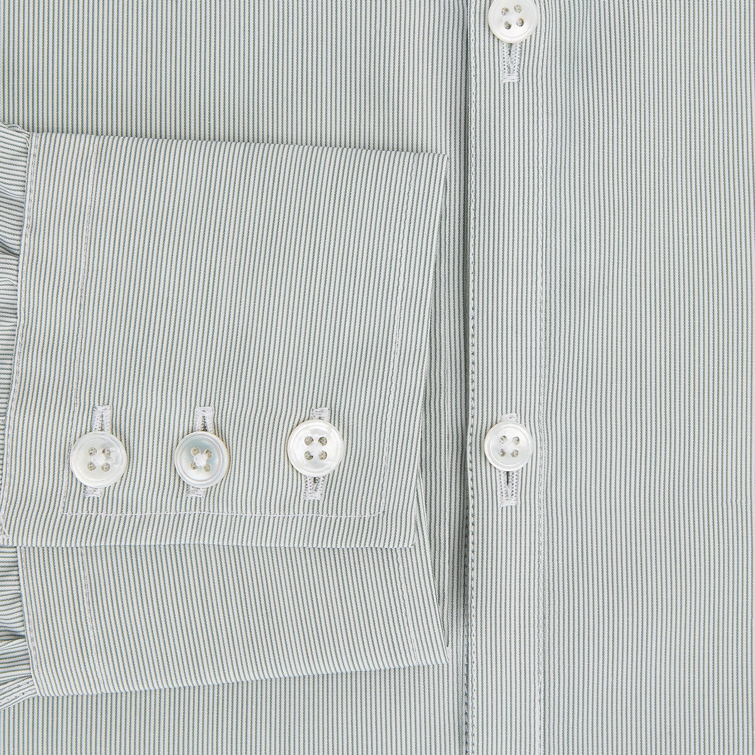 View 4 of product A dark green hairline stripe Westminster shirt by Turnbull & Asser, featuring long sleeves, a classic collar, tailored fit, white front buttons, and buttoned cuffs, laid flat on a white background.