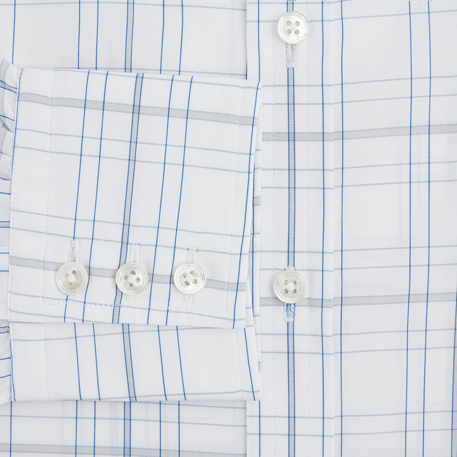 View 4 of product The Turnbull & Asser Blue and Grey Multi Check Mayfair Shirt features a T&A collar, cuffed long sleeves, and a light blue and gray plaid pattern on white.