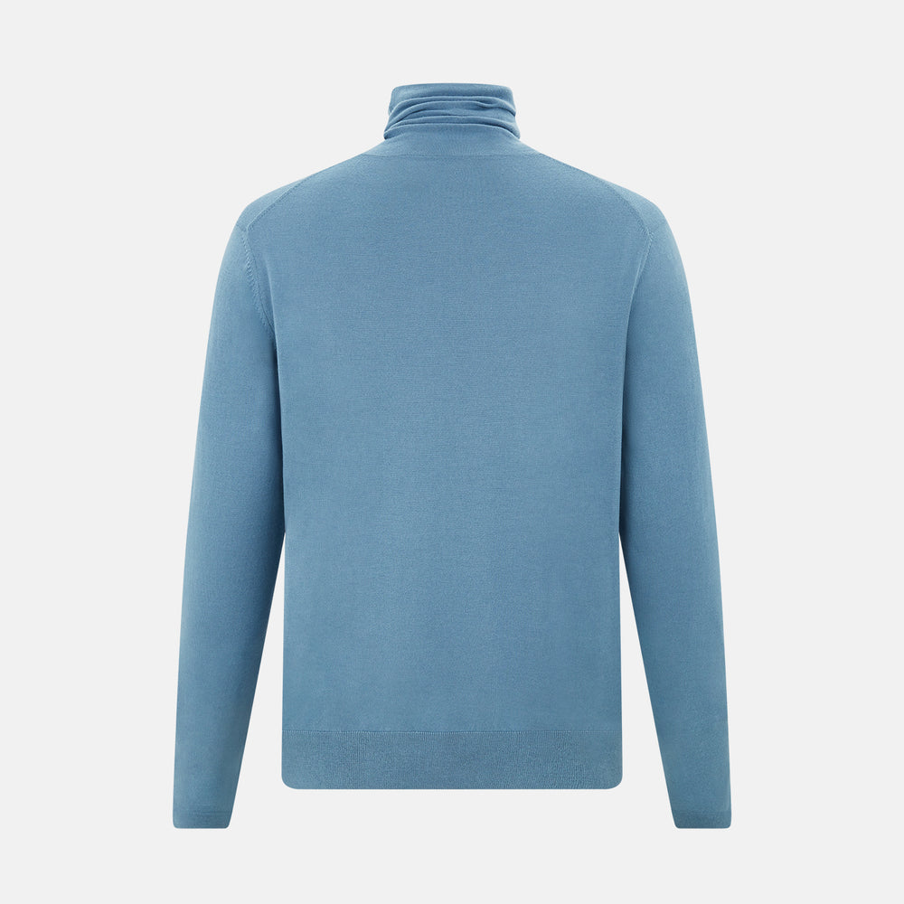 Turnbull & Asser's Pale Blue Fine Merino High Neck Jumper is shown on a plain white background, featuring a simple, classic design with long sleeves and no visible patterns or embellishments.