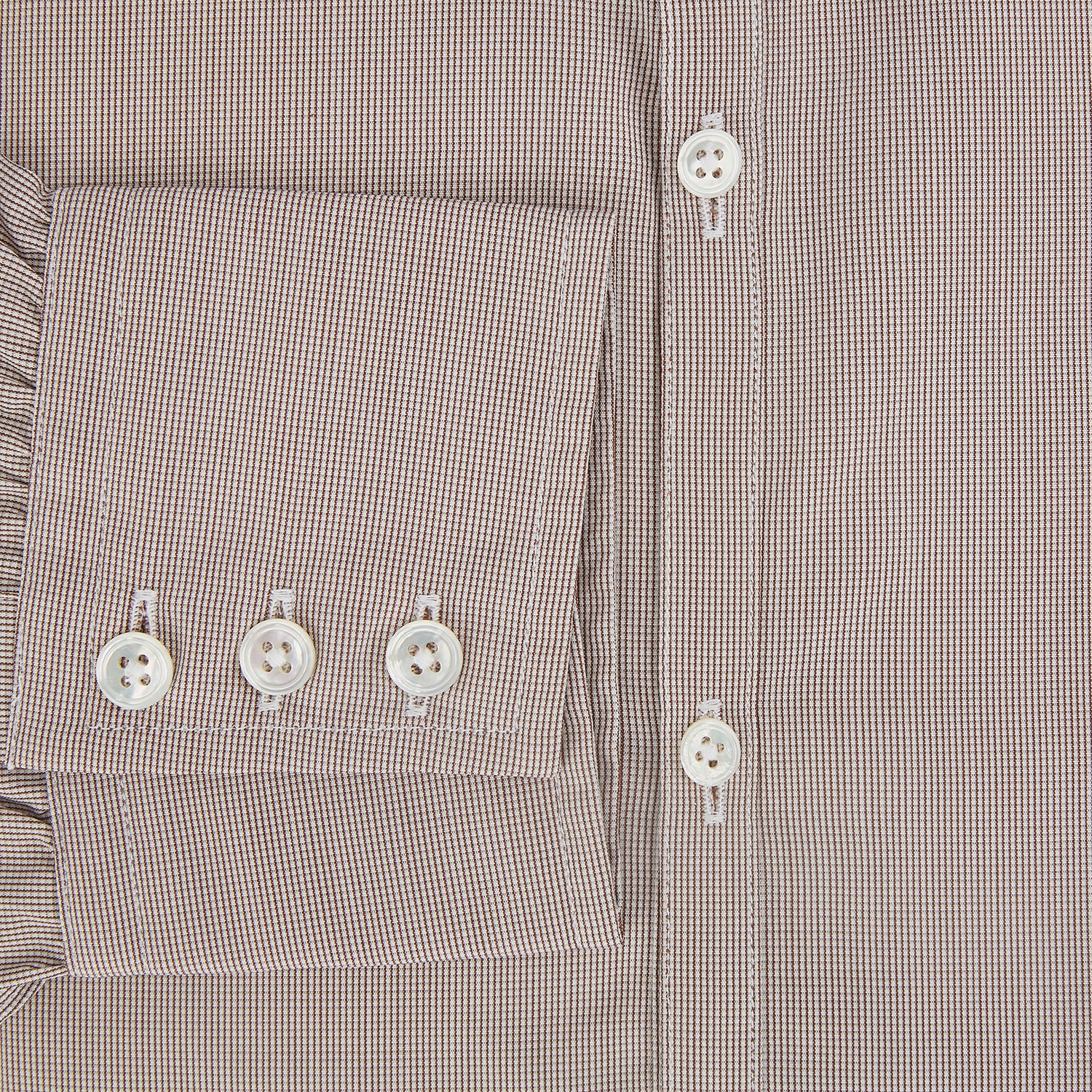 View 4 of product The Turnbull & Asser Brown Micro Graph Check Westminster shirt features long sleeves, a pointed collar, and buttoned cuffs—showcasing British craftsmanship and displayed flat on a white background.