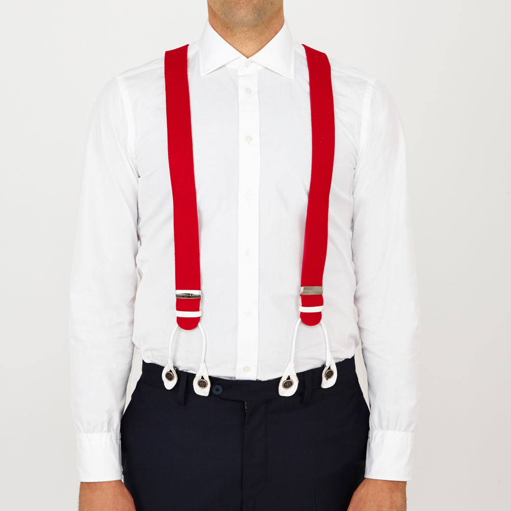 Two Red Adjustable Felt Braces by Turnbull & Asser, featuring white leather ends and silver-tone clasps, made in England from classic boxcloth, are laid flat on a white background.