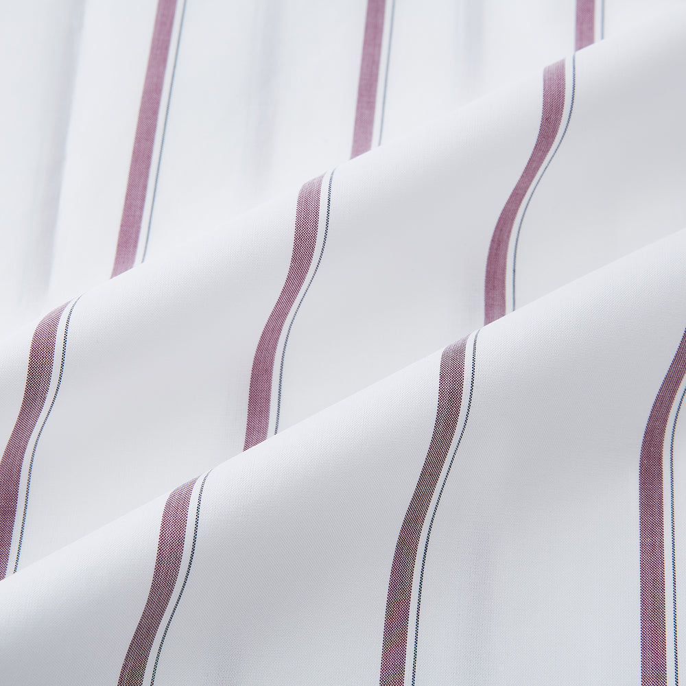 The Turnbull & Asser Wine Track Stripe Mayfair Shirt is a white long-sleeve shirt with vertical wine stripes and a pointed collar, crafted from premium Italian cotton and shown flat against a plain background.