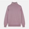 View 1 of product The Turnbull & Asser Lilac Heather Aubrey Cashmere Roll Neck Jumper features ribbed cuffs and hem—ideal for pairing with your favorite tailored trousers.