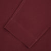 View 3 of product The Turnbull & Asser Burgundy Silk Pyjama Set features a long-sleeve, button-up shirt with chest pocket and matching pants with elastic waistband and side pocket, shown on a white background.