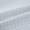 View 6 of product The Turnbull & Asser Navy and Blue Multi Grid Check Mayfair Shirt is a long-sleeve, button-up Italian cotton shirt with a collar and cuffs, featuring a blue grid check pattern, shown against a plain white background.