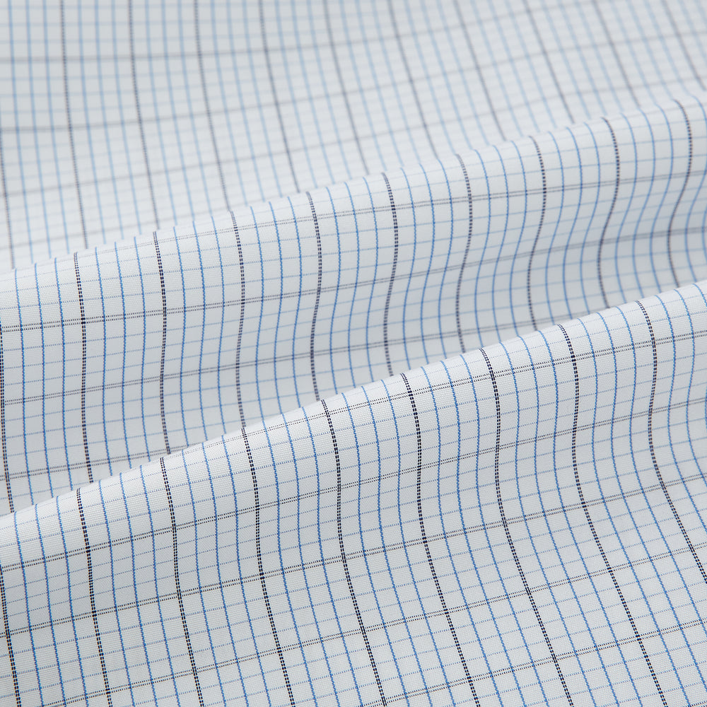 The Turnbull & Asser Navy and Blue Multi Grid Check Mayfair Shirt is a long-sleeve, button-up Italian cotton shirt with a collar and cuffs, featuring a blue grid check pattern, shown against a plain white background.