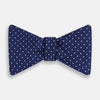 View 1 of product The Turnbull & Asser Azzurro and White Spot Silk Bow Tie features a classic blue silk design with small white spots, shown elegantly against a plain white background.