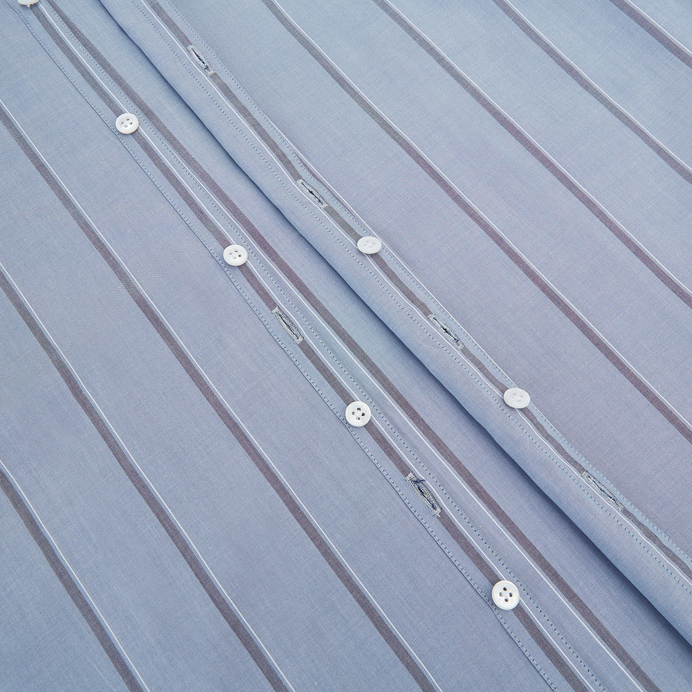 The Steel Blue Track Stripe Westminster Shirt by Turnbull & Asser features dark pinstripes, a classic collar, white buttons, and buttoned cuffs—expertly crafted to highlight British craftsmanship. Laid flat on white background.