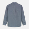 View 5 of product The Turnbull & Asser Plain Blue Oxford Cotton Weekend Fit Blake Shirt features long sleeves, a stand collar, and white buttons, displayed flat on a white background.