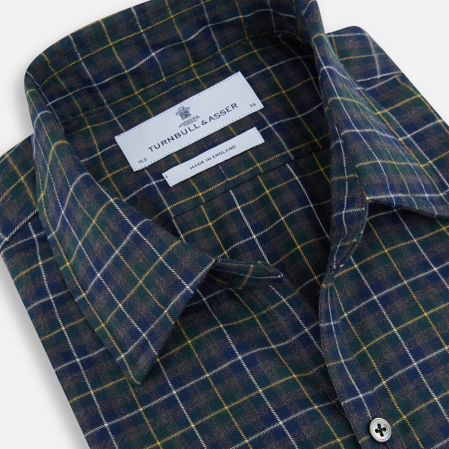 View 2 of product The Turnbull & Asser Navy and Khaki Tartan Windsor Shirt features a long-sleeve button-up design with a Windsor collar and buttoned cuffs, showcasing British craftsmanship in a classic tartan pattern.