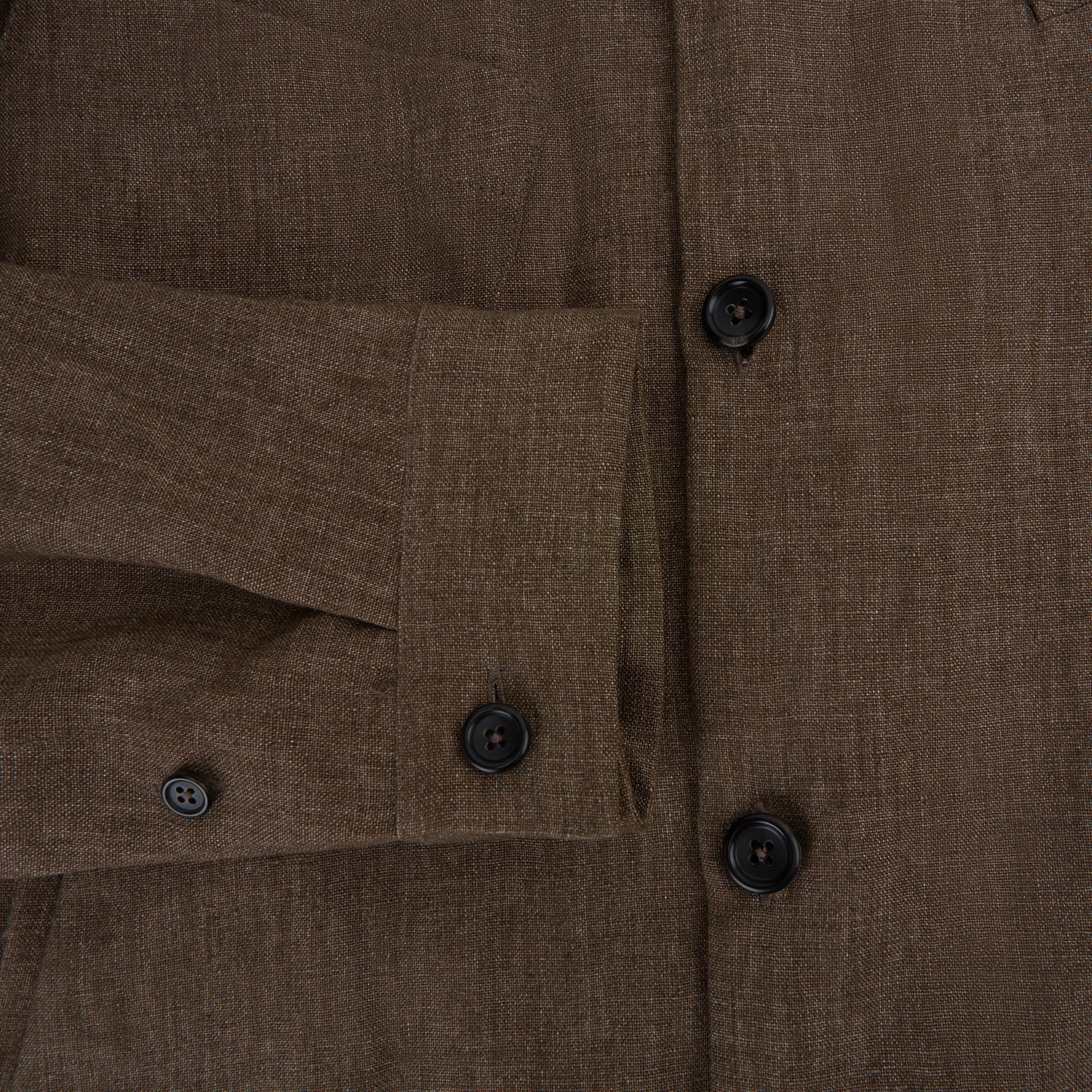 View 4 of product The Pine Cone Linen Holland Shacket by Turnbull & Asser is a brown men's lightweight outerwear piece with a collar, long sleeves, three front zip pockets, and black buttons, shown on a white background.